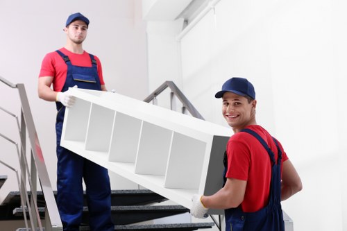 Movers handling a flat move near Bermondsey with stairs and parking challenges