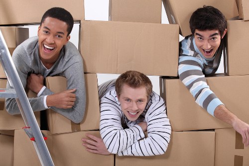 Local removals team handling a flat move in Bermondsey near stairwells and residential buildings
